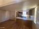 Spacious room with hardwood flooring, kitchen, and lots of potential at 2020 W Union Hills Dr # 240, Phoenix, AZ 85027