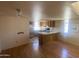 Spacious room with hardwood flooring, kitchen, and lots of potential at 2020 W Union Hills Dr # 240, Phoenix, AZ 85027
