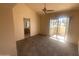 Bright bedroom with vaulted ceiling, ceiling fan, carpet, and access to an outdoor patio at 2020 W Union Hills Dr # 240, Phoenix, AZ 85027