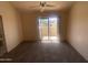 Spacious bedroom with carpet, ceiling fan, and patio access at 2020 W Union Hills Dr # 240, Phoenix, AZ 85027