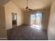 Bright bedroom with vaulted ceiling, ceiling fan, carpet, and access to an outdoor patio at 2020 W Union Hills Dr # 240, Phoenix, AZ 85027