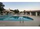 Community pool with inviting lounge chairs, a spa, and shaded seating areas around the pool at 2020 W Union Hills Dr # 240, Phoenix, AZ 85027