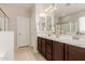 Beautiful bathroom with double vanity, tiled floor, and glass-enclosed shower at 20603 W Alsap Rd, Buckeye, AZ 85396