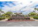 Community pool entrance featuring a brick welcome sign at Heritage Swim Park at 20603 W Alsap Rd, Buckeye, AZ 85396