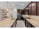 Gourmet kitchen featuring granite countertops, stainless steel appliances, and pendant lighting at 20603 W Alsap Rd, Buckeye, AZ 85396