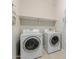 Laundry room with side by side washer and dryer and a white shelf above appliances at 20603 W Alsap Rd, Buckeye, AZ 85396