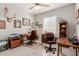 Spacious office features two desks, two office chairs, and natural light from a window at 20603 W Alsap Rd, Buckeye, AZ 85396