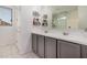 Stylish bathroom featuring a double vanity, modern fixtures, and plenty of storage space at 21824 S 226Th Pl, Queen Creek, AZ 85142