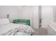 Bright bedroom with white walls, plush carpet, and a green crib at 21824 S 226Th Pl, Queen Creek, AZ 85142