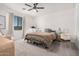 Airy bedroom with neutral decor, a comfortable armchair, and ample natural light at 21824 S 226Th Pl, Queen Creek, AZ 85142