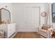 Adorable Bedroom with neutral walls, plush carpet, and a cozy armchair at 21824 S 226Th Pl, Queen Creek, AZ 85142