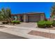 Charming single-story home with well-manicured landscaping and a neutral color palette at 21824 S 226Th Pl, Queen Creek, AZ 85142