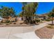 Lovely single-story home with lush landscaping and a welcoming entrance at 21824 S 226Th Pl, Queen Creek, AZ 85142