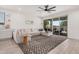 Comfortable living room featuring a large sectional sofa, sliding doors, and lots of light at 21824 S 226Th Pl, Queen Creek, AZ 85142