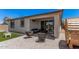 Cozy covered patio featuring modern outdoor furniture, a barrel sauna, and well-maintained landscaping at 21824 S 226Th Pl, Queen Creek, AZ 85142