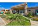 Expansive backyard featuring lush landscaping, covered patio with dining area, and stylish outdoor living space at 2308 E Dry Wood Rd, Phoenix, AZ 85024
