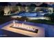 Backyard with cozy fire pit, lush landscape and ample space for entertaining at 2308 E Dry Wood Rd, Phoenix, AZ 85024
