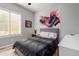 Bedroom featuring neutral tones, abstract art, and a window with shutters, creating a calming atmosphere at 2308 E Dry Wood Rd, Phoenix, AZ 85024