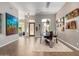 Elegant dining room featuring stylish decor, modern lighting, and a view towards the entryway at 2308 E Dry Wood Rd, Phoenix, AZ 85024