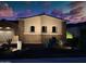 Charming home exterior with desert landscaping and warm lighting creating curb appeal at 2308 E Dry Wood Rd, Phoenix, AZ 85024