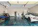 Spacious garage with epoxy floors, ample storage, two cars and plenty of room for parking and projects at 2308 E Dry Wood Rd, Phoenix, AZ 85024