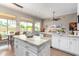 Open-concept kitchen with a large island, stainless steel appliances, and a connected dining area at 2308 E Dry Wood Rd, Phoenix, AZ 85024