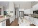 Bright kitchen with granite countertops, stainless steel appliances, and ample cabinet space at 2308 E Dry Wood Rd, Phoenix, AZ 85024