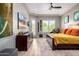 Serene main bedroom with a ceiling fan, wood floors, and ample natural light at 2308 E Dry Wood Rd, Phoenix, AZ 85024