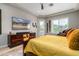 Relaxing main bedroom with a ceiling fan, wood-style floors, and comfortable furniture at 2308 E Dry Wood Rd, Phoenix, AZ 85024