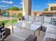 Inviting patio with plush seating, a marble coffee table, and a serene backyard view at 2308 E Dry Wood Rd, Phoenix, AZ 85024