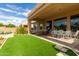 Covered patio with stylish outdoor seating and dining area, perfect for entertaining at 2308 E Dry Wood Rd, Phoenix, AZ 85024