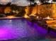 Outdoor poolside with fire bowls ablaze for a cozy, nighttime swimming experience at 2308 E Dry Wood Rd, Phoenix, AZ 85024