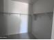 Walk-in closet featuring shelving; a practical storage solution for any bedroom at 24104 W Bowker St, Buckeye, AZ 85326