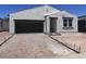Charming single-story home with a stucco exterior, attached garage, and a modern design at 24104 W Bowker St, Buckeye, AZ 85326
