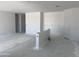 Spacious living room with an open floor plan awaiting its finishing touches at 24104 W Bowker St, Buckeye, AZ 85326