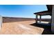 Backyard features a covered patio and block wall at 25133 W Wayland Dr, Buckeye, AZ 85326