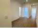 Bright hallway boasts luxury vinyl plank flooring, recessed lighting, and an inviting view into other rooms of the home at 25133 W Wayland Dr, Buckeye, AZ 85326