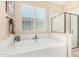 Bathroom featuring a large soaking tub and separate shower at 26330 N 56Th Dr, Phoenix, AZ 85083
