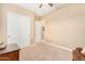 Bright bedroom featuring a closet with sliding doors and neutral color tones at 26330 N 56Th Dr, Phoenix, AZ 85083