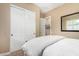 Bright bedroom featuring a closet with sliding doors and neutral color tones at 26330 N 56Th Dr, Phoenix, AZ 85083