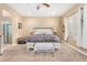 Comfortable bedroom featuring neutral paint, carpeted floors, and an ensuite bathroom at 26330 N 56Th Dr, Phoenix, AZ 85083