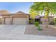 Charming single-story home with a three-car garage and desert landscaping at 26330 N 56Th Dr, Phoenix, AZ 85083