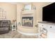 Living room showcases an inviting fireplace feature and a stylish entertainment center at 26330 N 56Th Dr, Phoenix, AZ 85083