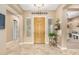 Elegant foyer features tile flooring and a decorative wood front door at 26330 N 56Th Dr, Phoenix, AZ 85083