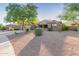 Charming single-story home with desert landscaping and mature trees at 26330 N 56Th Dr, Phoenix, AZ 85083