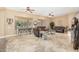 Spacious living room with neutral paint, tile flooring, and natural lighting at 26330 N 56Th Dr, Phoenix, AZ 85083