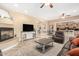 Comfortable living room featuring neutral color scheme, and a cozy fireplace at 26330 N 56Th Dr, Phoenix, AZ 85083
