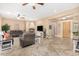 Large open-plan living space features a fireplace and easy access to other rooms at 26330 N 56Th Dr, Phoenix, AZ 85083