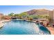 Backyard pool featuring dining set, waterfall feature, and beautiful mountain views at 26330 N 56Th Dr, Phoenix, AZ 85083