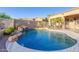 Beautiful backyard pool featuring a rock waterfall feature and mature trees at 26330 N 56Th Dr, Phoenix, AZ 85083